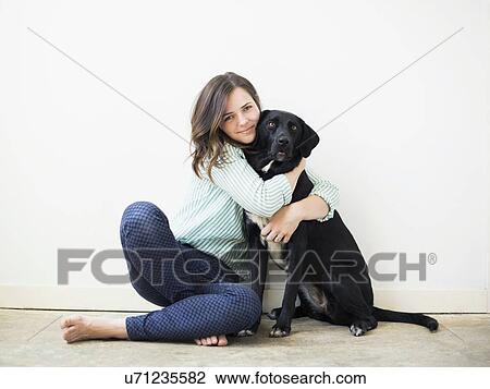 Portrait of woman with black dog View Large Photo Image Stock Image - Portrait of woman with black dog. Fotosearch