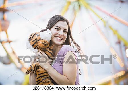 Portrait of woman with toy tiger View Large Photo Image Picture - Portrait of woman with toy tiger. Fotosearch