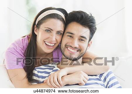 Picture - Portrait of young couple smiling. Fotosearch