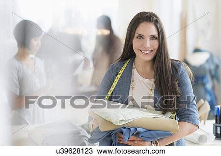 Portrait of young fashion designer in studio View Large Photo Image Stock Image - Portrait of young fashion designer in studio. Fotosearch