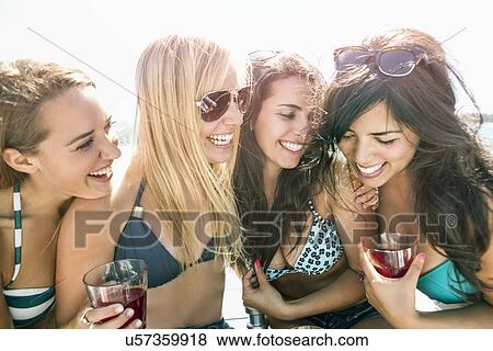 Stock Photo - Portrait of young women having fun. Fotosearch