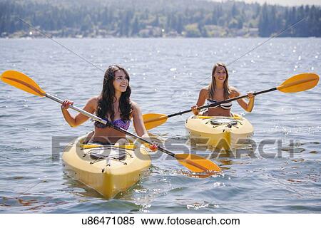 Portrait of young women kayaking View Large Photo Image Stock Photography - Portrait of young women kayaking. Fotosearch