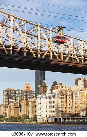 Queensboro Bridge and overhead cable car View Large Photo Image Stock Photo - Queensboro Bridge and overhead cable car . Fotosearch