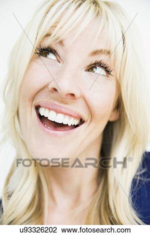 Studio portrait of cheerful blonde woman View Large Photo Image Stock Image - Studio portrait of cheerful blonde woman. Fotosearch