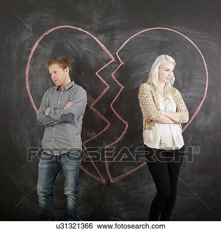 Studio portrait of separated couple View Large Photo Image Stock Photograph - Studio portrait of separated couple. Fotosearch