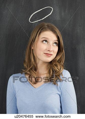 Stock Photography - Studio portrait of woman with chalk halo. Fotosearch