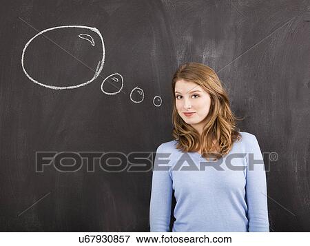 Stock Photo - Studio portrait of woman with chalk thought bubble. Fotosearch