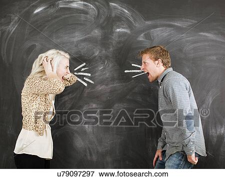 Studio portrait of young couple shouting at each other View Large Photo Image Stock Photo - Studio portrait of young couple shouting at each other. Fotosearch