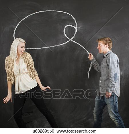 Studio portrait of young couple with chalk lasso View Large Photo Image Stock Image - Studio portrait of young couple with chalk lasso. Fotosearch