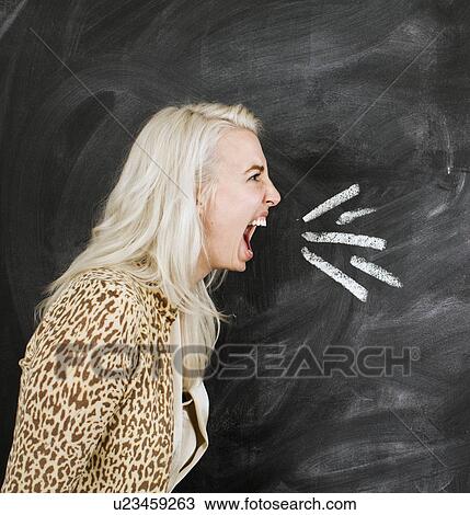 Studio portrait of young woman shouting View Large Photo Image Stock Image - Studio portrait of young woman shouting. Fotosearch