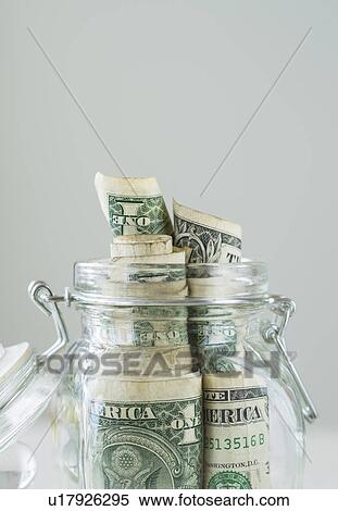 Studio shot of savings in jar View Large Photo Image Stock Photography - Studio shot of savings in jar. Fotosearch