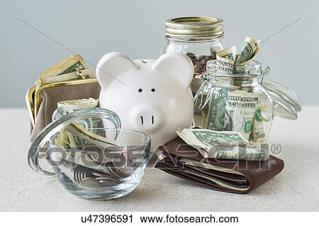 Studio shot of savings in jars View Large Photo Image Stock Image - Studio shot of savings in jars. Fotosearch