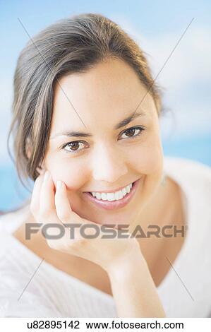 Studio Shot of smiling woman with brown hair View Large Photo Image Stock Image - Studio Shot of smiling woman with brown hair. Fotosearch