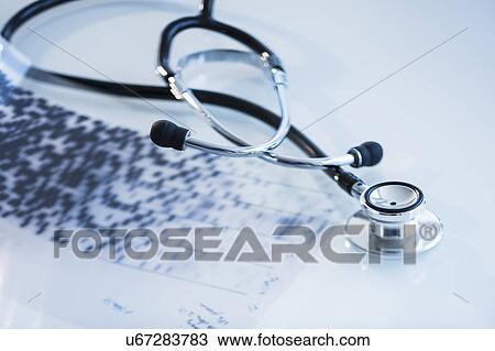 Stock Image - Studio shot of stethoscope with dna test. Fotosearch