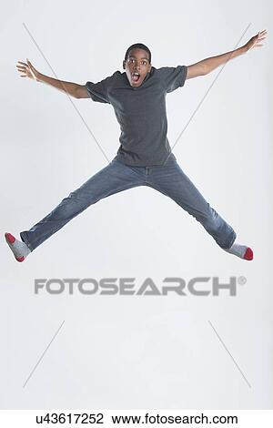 Studio Shot of teenage boy (14-15) jumping View Large Photo Image Stock Image - Studio Shot of teenage boy (14-15) jumping. Fotosearch