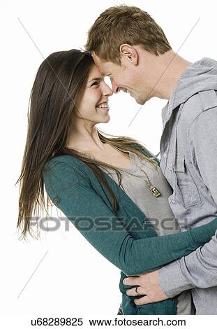 Studio shot of young couple View Large Photo Image Stock Photography - Studio shot of young couple. Fotosearch