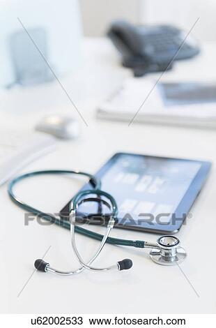 Tablet pc in doctor's office View Large Photo Image Stock Image - Tablet pc in doctor's office. Fotosearch