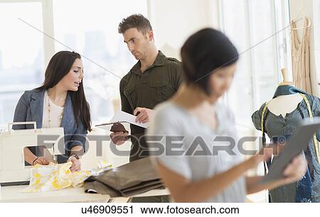 Three fashion designers working in studio View Large Photo Image Stock Image - Three fashion designers working in studio. Fotosearch