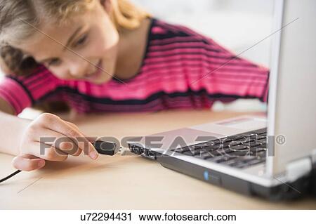 View of girl (8-9) using laptop View Large Photo Image Stock Image - View of girl (8-9) using laptop. Fotosearch