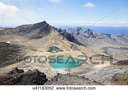 Stock Image - Volcanic landscape with lake. Fotosearch