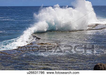Wave crushing on rock View Large Photo Image Stock Photograph - Wave crushing on rock. Fotosearch