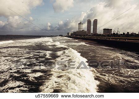 Waves of Indian Ocean and city skyline View Large Photo Image Stock Photo - Waves of Indian Ocean and city skyline. Fotosearch