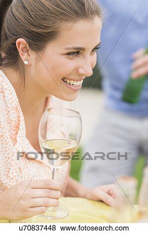 Stock Photo - Woman drinking white wine. Fotosearch