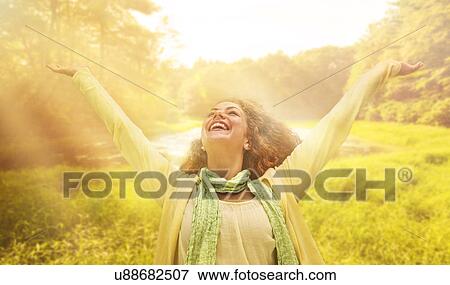 Woman reaching up to sunrays View Large Photo Image Stock Photo - Woman reaching up to sunrays. Fotosearch