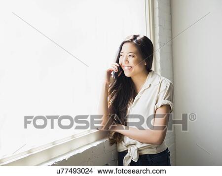 Woman talking on phone View Large Photo Image Picture - Woman talking on phone. Fotosearch