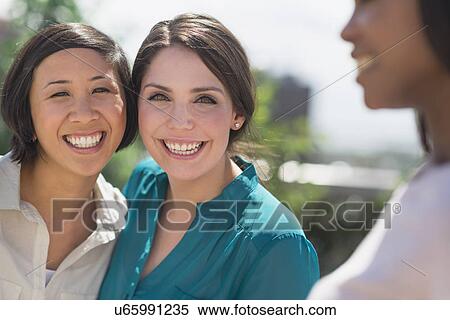 Women laughing outside View Large Photo Image Stock Photography - Women laughing outside. Fotosearch