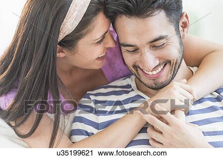 Young couple embracing View Large Photo Image Stock Image - Young couple embracing. Fotosearch