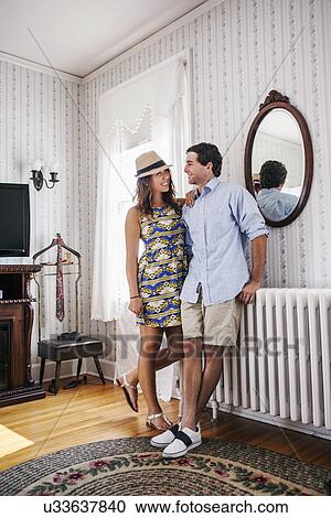 Young couple in hotel room View Large Photo Image Stock Image - Young couple in hotel room. Fotosearch