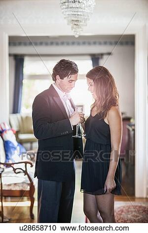 Young elegant couple drinking wine View Large Photo Image Stock Image - Young elegant couple drinking wine. Fotosearch
