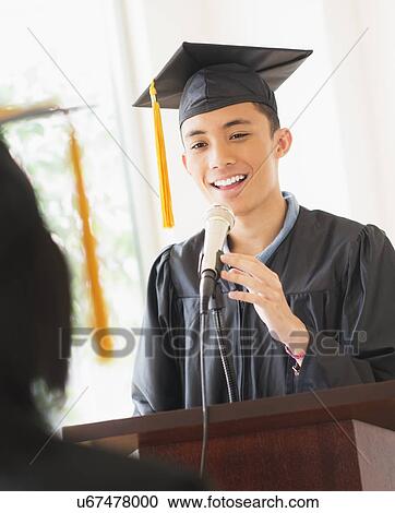 Young man giving speech at graduation View Large Photo Image Stock Image - Young man giving speech at graduation. Fotosearch