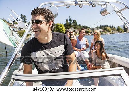 Young people enjoying speedboat ride View Large Photo Image Stock Photo - Young people enjoying speedboat ride. Fotosearch