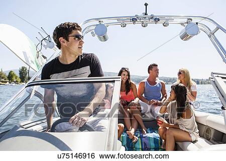 Young people enjoying speedboat ride View Large Photo Image Stock Photograph - Young people enjoying speedboat ride. Fotosearch