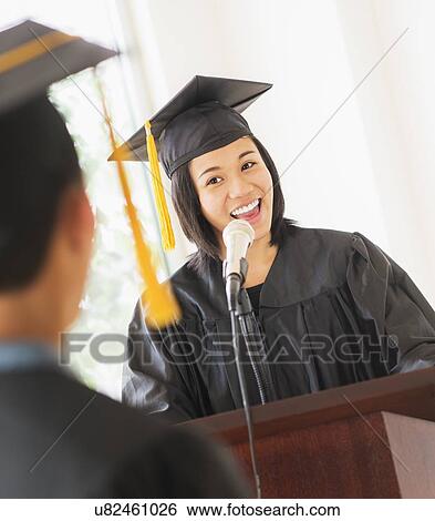 Young woman giving speech at graduation View Large Photo Image Stock Photograph - Young woman giving speech at graduation. Fotosearch