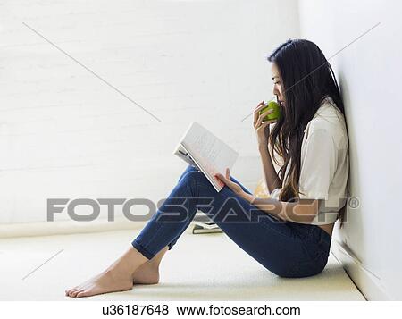Young woman reading View Large Photo Image Stock Photo - Young woman reading. Fotosearch