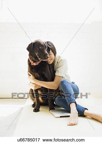 Stock Photo - Young woman with labrador. Fotosearch