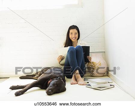 Stock Photograph - Young woman with labrador . Fotosearch