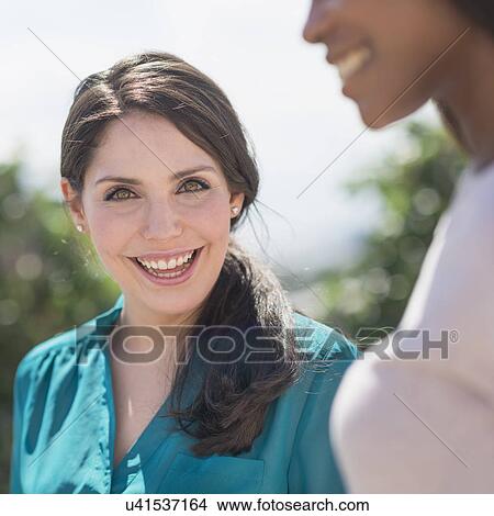 Picture - Young women smiling. Fotosearch