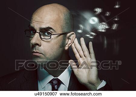 Bald businessman listening to music View Large Photo Image Stock Photo - Bald businessman listening to music. Fotosearch