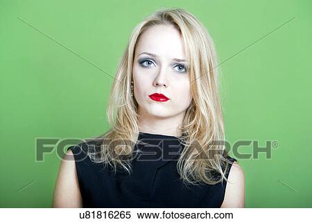 Blonde woman on green background View Large Photo Image Stock Photography - Blonde woman on green background. Fotosearch