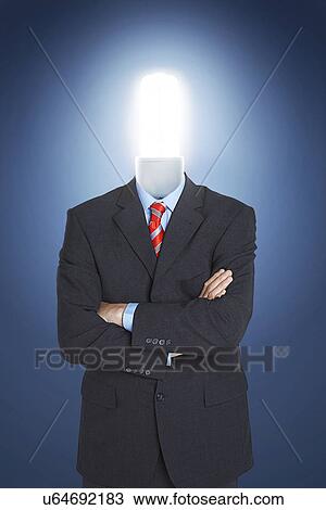 Stock Image - Businessman with economical friendly light bulb for head. Fotosearch