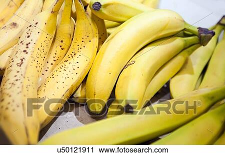 Stock Image - Close-up of bananas in market. Fotosearch