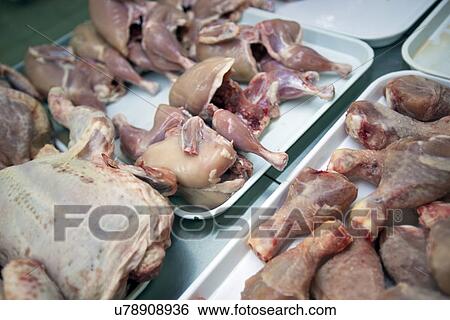 Close-up of raw chickens in trays at supermarket View Large Photo Image Stock Photograph - Close-up of raw chickens in trays at supermarket. Fotosearch
