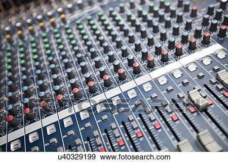 Stock Photo - Close-up of sound mixing equipment in studio. Fotosearch