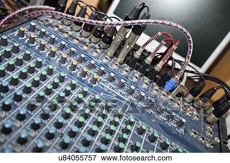 Stock Photo - Close-up of sound mixing equipment in television studio. Fotosearch