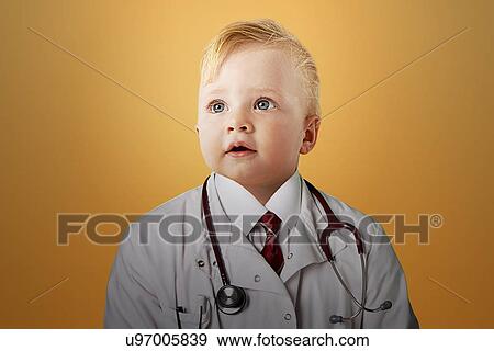 Stock Photo - Close up view of Caucasian baby dressed as a doctor. Fotosearch