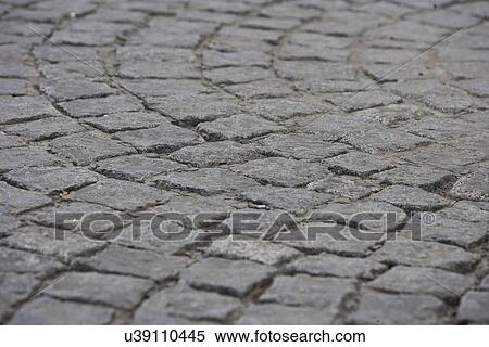 Stock Photography - Close-up view of cobbled street. Fotosearch